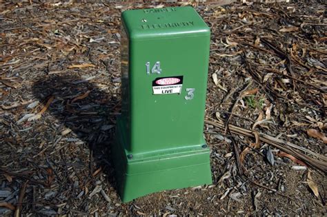 electric green box|green electrical boxes on property.